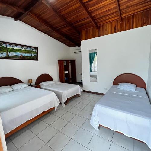 Ένα ή περισσότερα κρεβάτια σε δωμάτιο στο Hotel Villa Fortuna