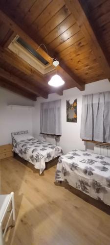 En eller flere senge i et værelse på Mansarda nelle Dolomiti