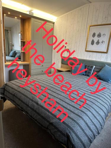 a sign that says new bed in a bedroom at Holiday escapes by the bay in Heysham