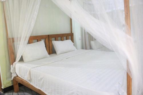 Postel nebo postele na pokoji v ubytování Sigiriya Nature View home Stay