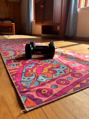 a rug on a wooden floor with ainylinylinylinylinylinylinylinyl at On the Rocks @ Eersterivier in Eersterivierstrand