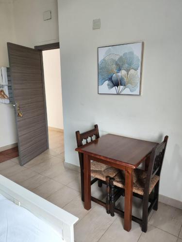 a dining room with a table and a chair at L'Olivera Casa Rural in Castellbisbal