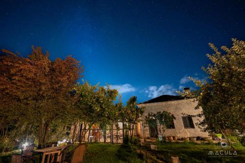 a night view of a building at night at KATIKIA ZAGORI in Vitsa