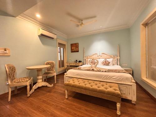 Cama o camas de una habitación en Ratnawali – A Vegetarian Heritage Hotel