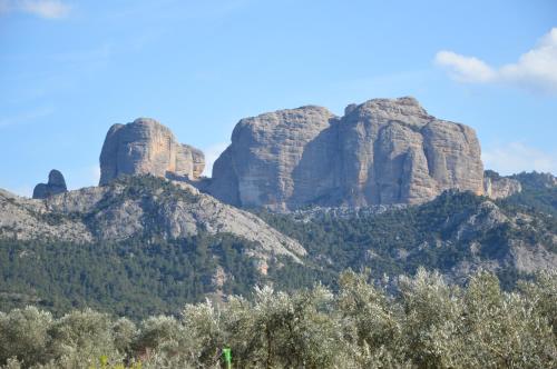 a mountain with two large rocks on top of it at Cal Gorro in Arnés
