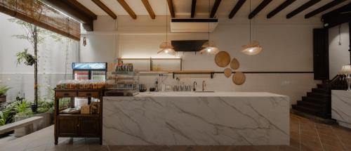 a kitchen with a large counter in a room at Armenian House by IIP in George Town