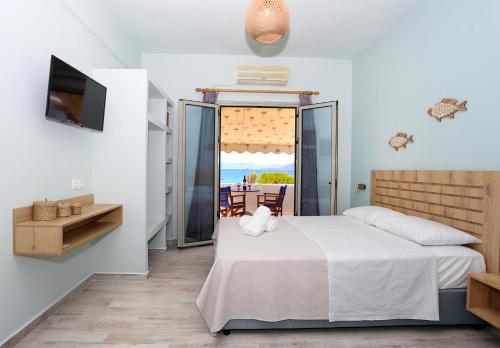 Ένα ή περισσότερα κρεβάτια σε δωμάτιο στο The Beach