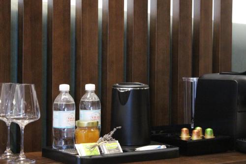 a table with two bottles of water and a glass at Shypit Spa&Resort in Pilipets