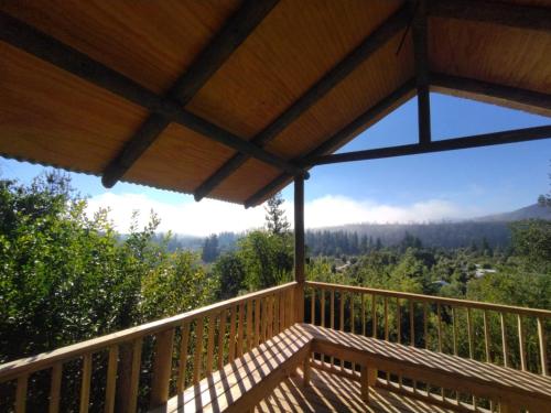 a balcony with a view of the mountains at Cabaña Loma Eco-sol in Molina