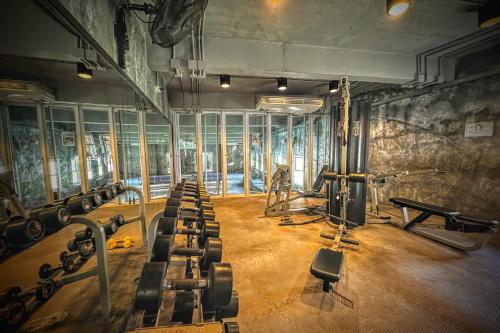 a gym with a bunch of equipment in a room at Z Loft Seaside FashionDesigner Loft in Bophut 