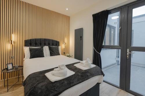 Katil atau katil-katil dalam bilik di Cosy Modern Flat Sleeps 3 With Direct Links to Central London - Flat 1