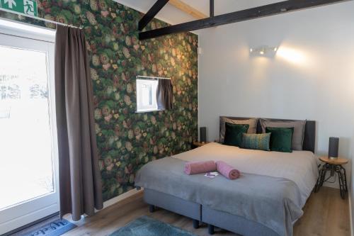 Postel nebo postele na pokoji v ubytování B&B Hoeve de Veldmaat
