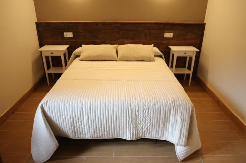 Hostal-Cicloturismo Lopeneaにあるベッド