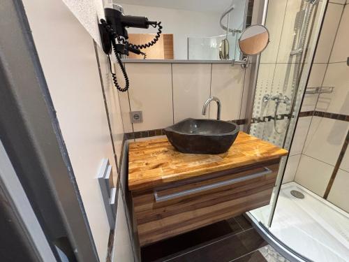 a bathroom with a sink and a shower at Alpinchalet Eder - Steiner in Saalbach-Hinterglemm