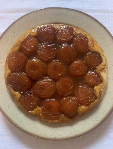 a pepperoni pie on a plate on a table at Chambres d'Hôtes La Petite Odile in Boersch