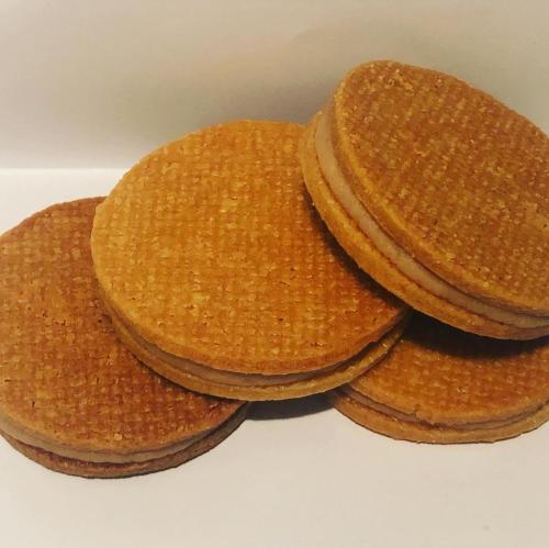 three stack of pancakes sitting on a white plate at Chambres d'Hôtes La Petite Odile in Boersch