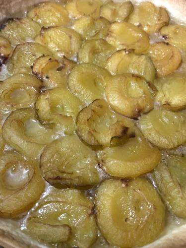 a close up of a pan of food with bananas at Chambres d'Hôtes La Petite Odile in Boersch