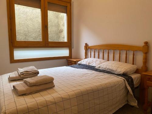 Postel nebo postele na pokoji v ubytování Cal Nas Ratat