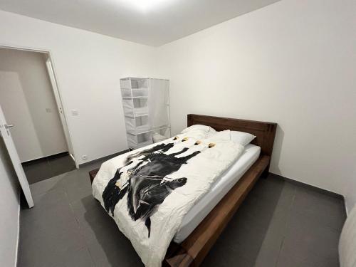 Postel nebo postele na pokoji v ubytování Appartements Charles De Gaulle
