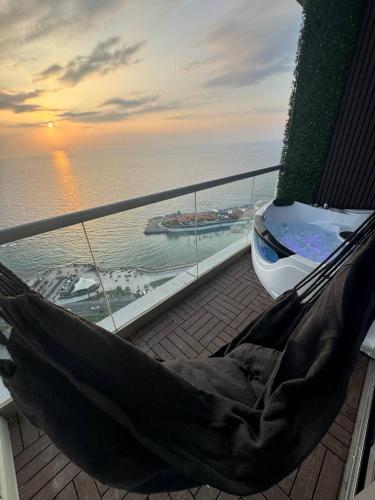 a hammock on the deck of a cruise ship at برج داماك الكورنيش جدة - Damac Tower Corniche Jeddah in Jeddah