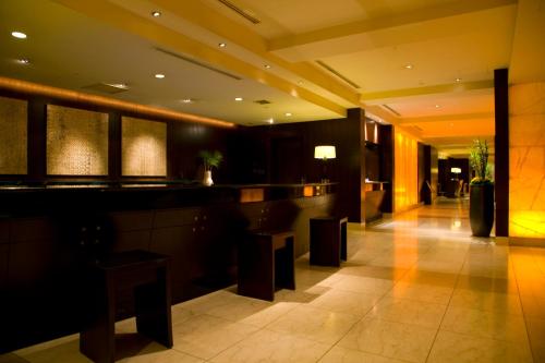 a lobby with a bar in a hotel at Sheraton Miyako Hotel Osaka in Osaka