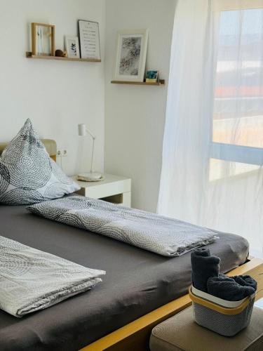 a bedroom with two beds and a window at Haus am Wasserturm Gästezimmer in Schorndorf-Schlichten in Schorndorf