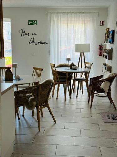 a dining room with a table and chairs at Haus am Wasserturm Gästezimmer in Schorndorf-Schlichten in Schorndorf