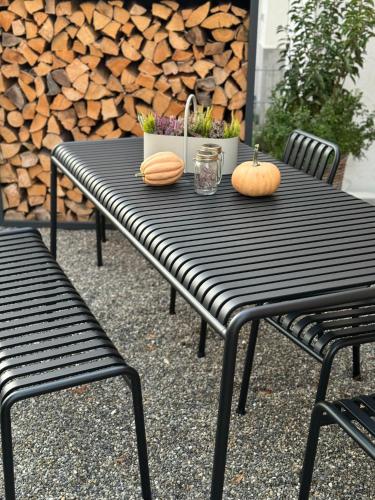 a black table with two pumpkins on top of it at Haus am Wasserturm Gästezimmer in Schorndorf-Schlichten in Schorndorf
