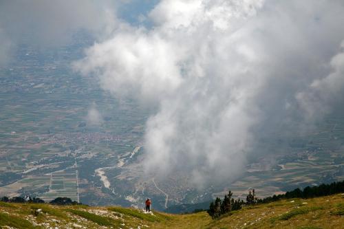 a person standing on top of a hill overlooking a valley at Hotel Villa Drosos in Litochoro