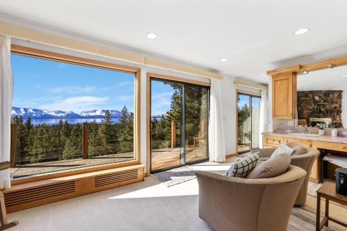 a living room with a large window with a view at Tallac View in Stateline