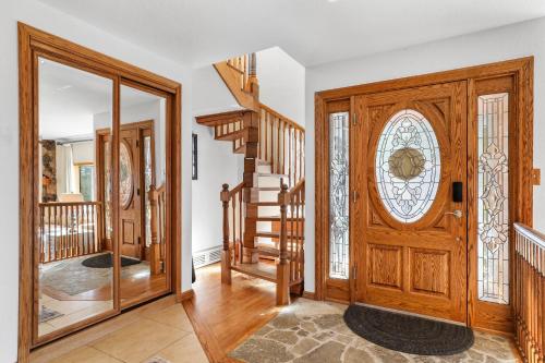 a home with a wooden door and stairs at Tallac View in Stateline