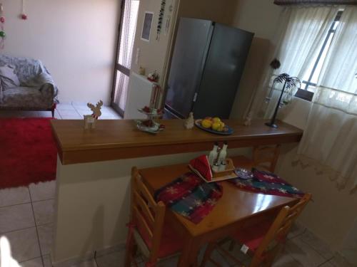 a kitchen with a table and a small table and a table and a tableablish at Mountain View in Feneos