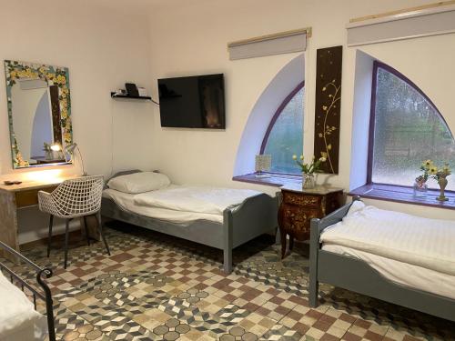 Postel nebo postele na pokoji v ubytování JANUS COUNTRY SITE Árpád-ház