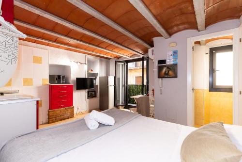 a bedroom with a large white bed with two pillows at Trinquet by Unik Vacation in Tarragona