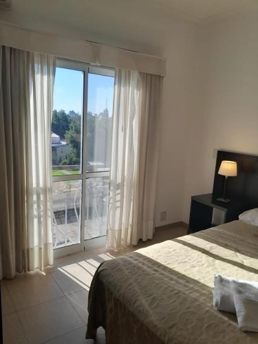 Ένα ή περισσότερα κρεβάτια σε δωμάτιο στο Antares Apartments