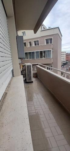a balcony of a building with a television on it at Affittacamere Cossetti in Pordenone