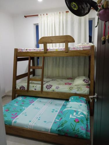 Letto o letti in una camera di Confortable casa vacacional en Carmen de Apicalá