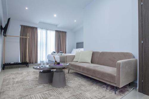 a living room with a couch and a table at Athens Luxury center Aparts F&G in Athens