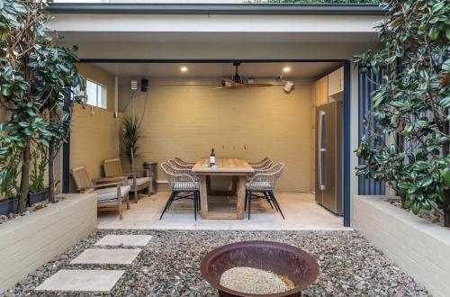 an outdoor patio with a table and chairs at Millers Point Home Harbourside in Sydney