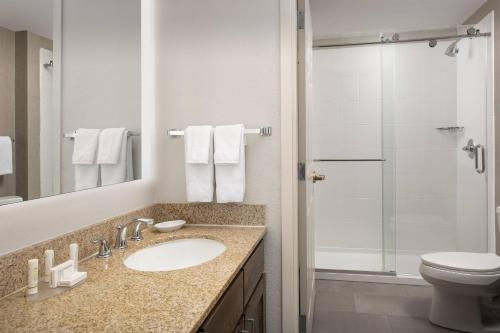 a bathroom with a sink and a toilet and a shower at Residence Inn Denver South/Park Meadows Mall in Centennial