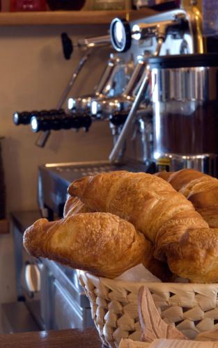 a basket of bread sitting on top of a counter at Palazzo Brandano Hotel in Petroio