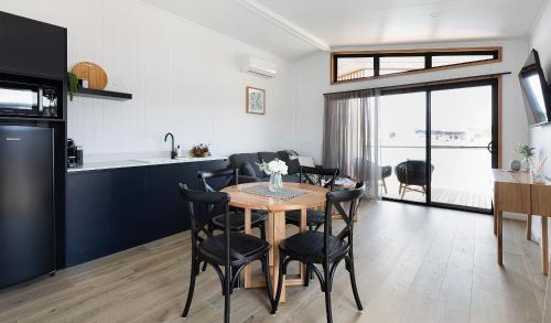 a kitchen and dining room with a table and chairs at Whitton Malt House in Whitton