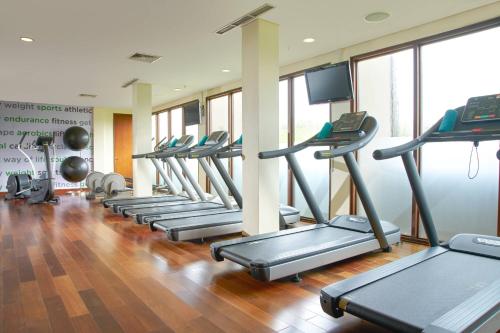 a row of treadmills in a gym at Courtyard by Marriott Bali Nusa Dua Resort in Nusa Dua