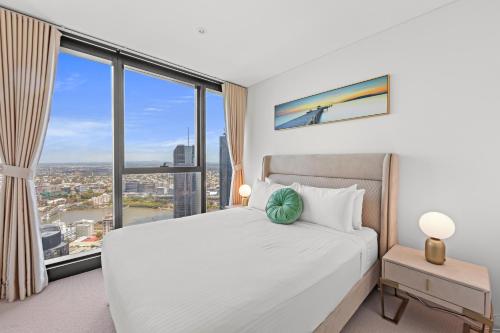 Voodi või voodid majutusasutuse Brisbane Skytower by CLLIX toas