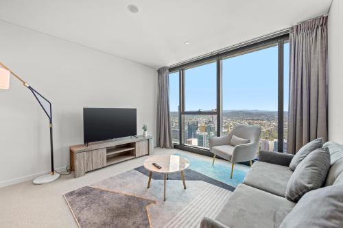Televiisor ja/või meelelahutuskeskus majutusasutuses Brisbane Skytower by CLLIX