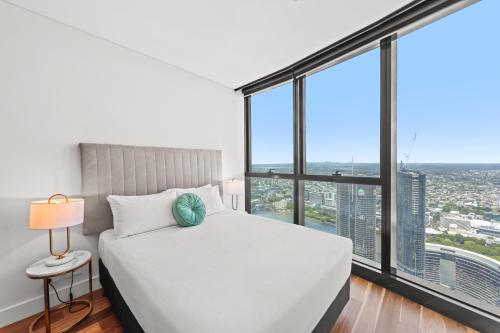 Voodi või voodid majutusasutuse Brisbane Skytower by CLLIX toas