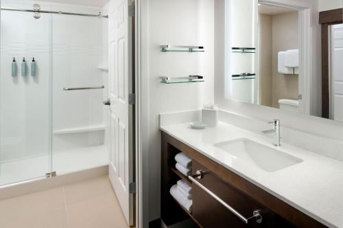 a bathroom with a sink and a shower at Residence Inn Asheville Biltmore in Asheville