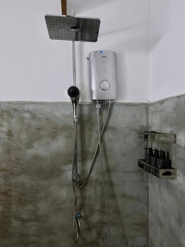 a shower in the corner of a bathroom at Babybong Koh Rong in Koh Rong
