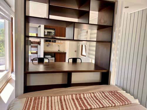 a kitchen with a wooden table in a room at Altos de Guayacan 2 in San José de Maipo