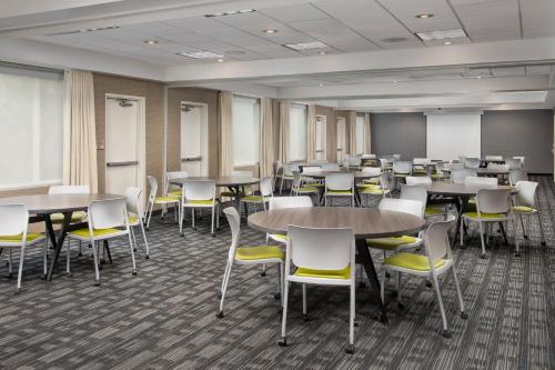a classroom with tables and chairs in a room at SpringHill Suites by Marriott Boise ParkCenter in Boise
